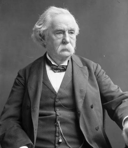 Black and white portrait photograph of an older Thomas Keefer with white hair and a white moustache