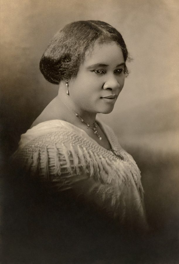 Black and white portrait photograph of Madam C. J. Walker with her hair pinned up